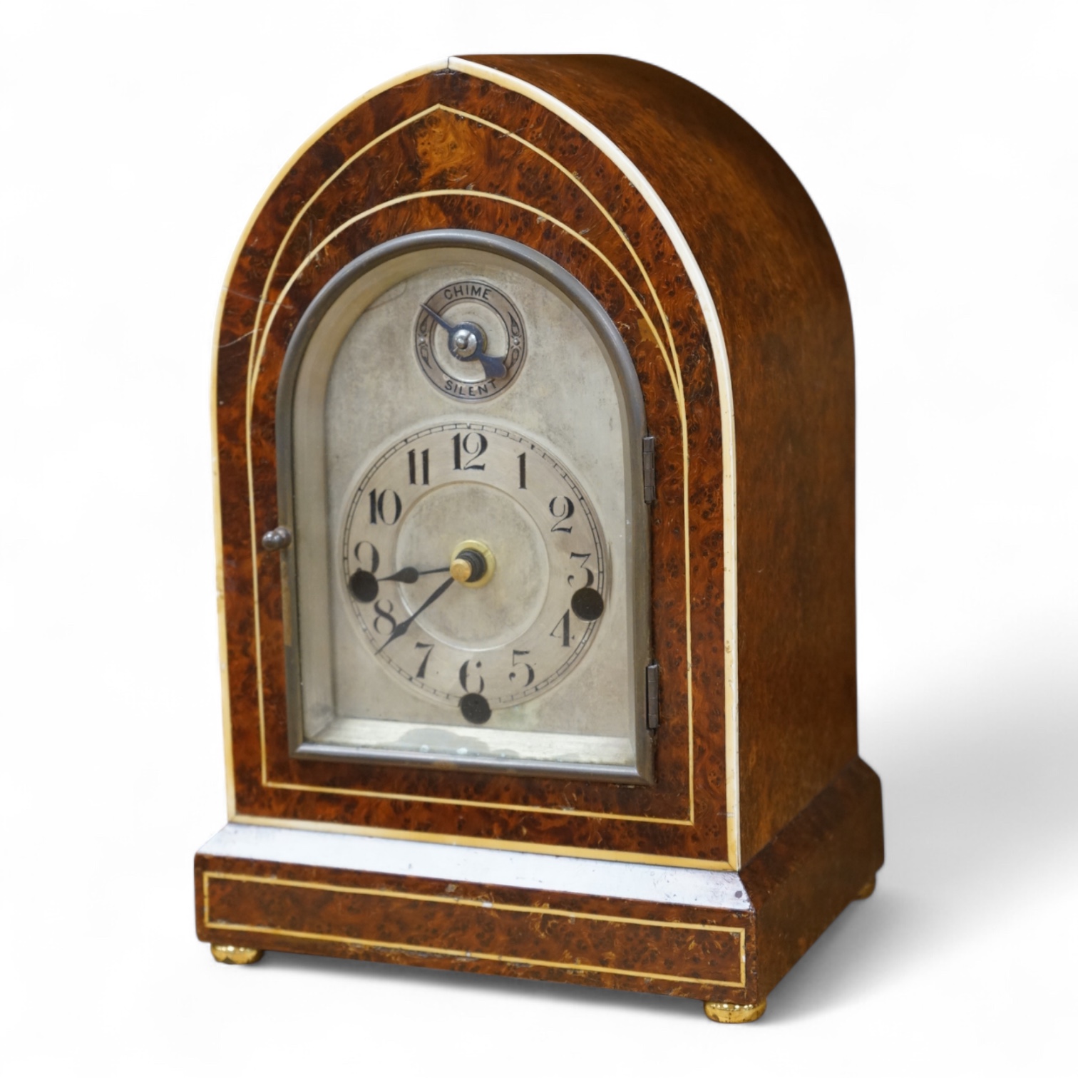 An early 20th century French eight day Amboyna mantel clock, with Holly and ivory stringing, retailed by Charles Frodsham, 25cm high CITES Submission reference 3SPE5K23